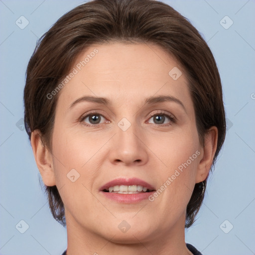 Joyful white adult female with short  brown hair and brown eyes