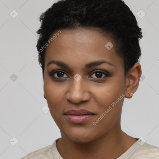 Joyful black young-adult female with short  black hair and brown eyes