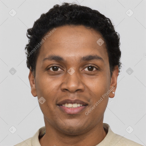 Joyful black young-adult male with short  black hair and brown eyes