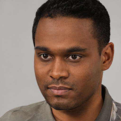 Neutral black young-adult male with short  black hair and brown eyes