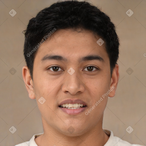 Joyful latino young-adult male with short  black hair and brown eyes