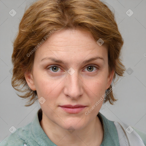 Joyful white adult female with medium  brown hair and blue eyes