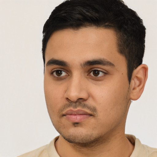 Neutral latino young-adult male with short  black hair and brown eyes