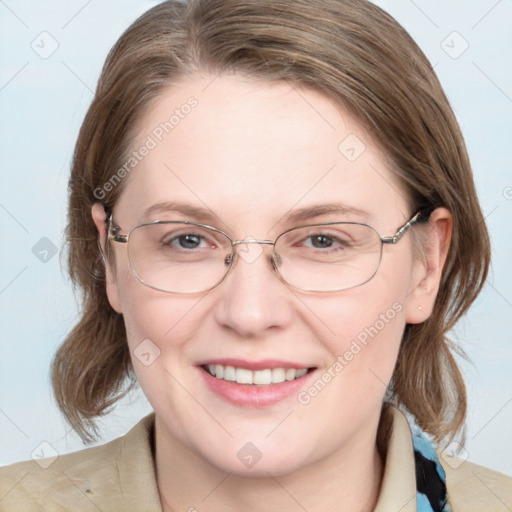 Joyful white adult female with medium  brown hair and blue eyes