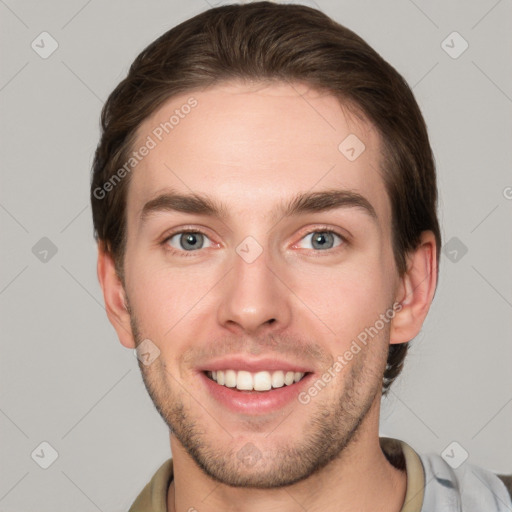 Joyful white young-adult male with short  brown hair and grey eyes