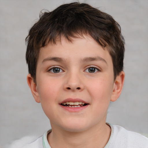 Joyful white child male with short  brown hair and brown eyes