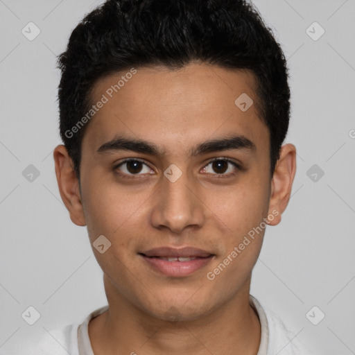 Joyful latino young-adult male with short  brown hair and brown eyes