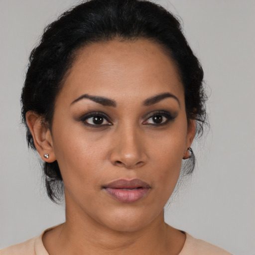 Neutral latino young-adult female with medium  black hair and brown eyes