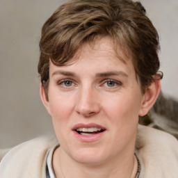 Joyful white young-adult female with medium  brown hair and green eyes