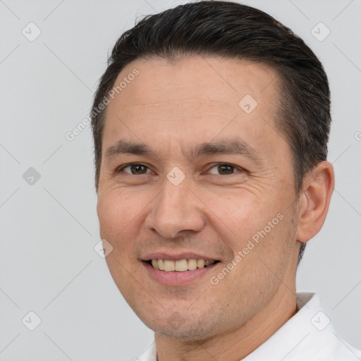 Joyful white adult male with short  brown hair and brown eyes