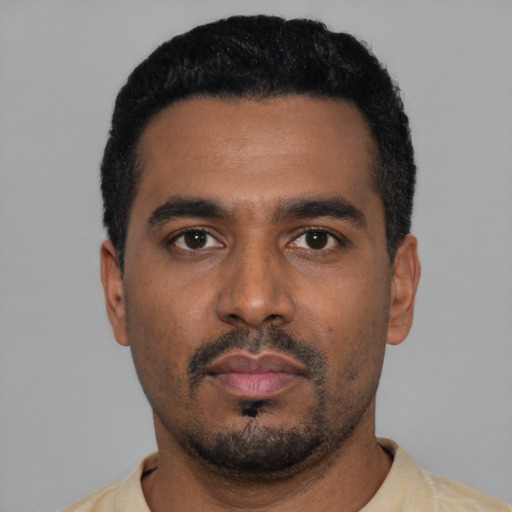 Neutral black young-adult male with short  black hair and brown eyes