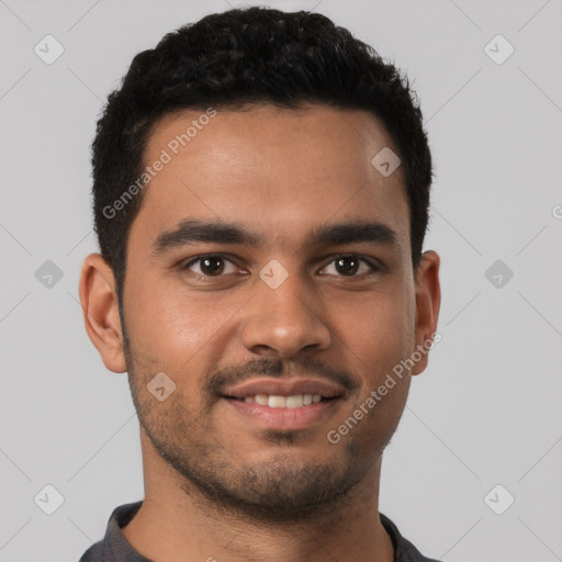 Joyful latino young-adult male with short  brown hair and brown eyes