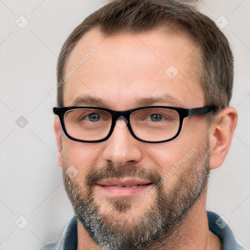 Joyful white adult male with short  brown hair and brown eyes