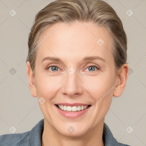 Joyful white adult female with short  brown hair and grey eyes