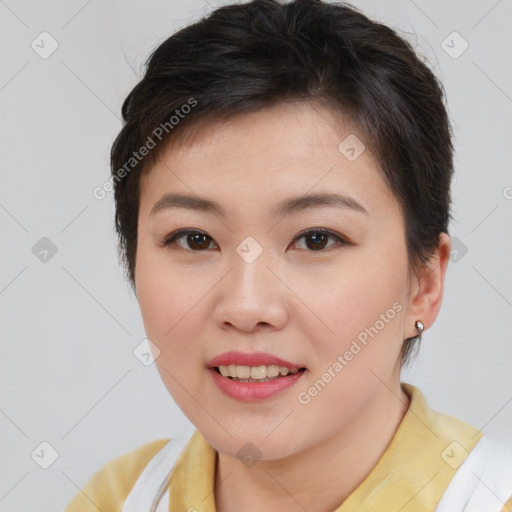 Joyful asian young-adult female with short  brown hair and brown eyes