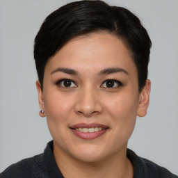 Joyful asian young-adult female with short  brown hair and brown eyes