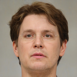 Neutral white adult male with short  brown hair and grey eyes