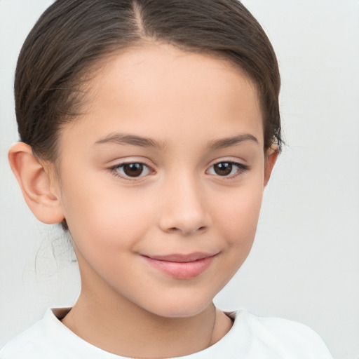 Joyful white child female with short  brown hair and brown eyes