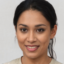 Joyful asian young-adult female with medium  brown hair and brown eyes