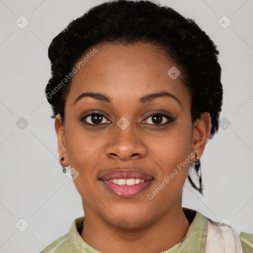 Joyful black young-adult female with short  black hair and brown eyes