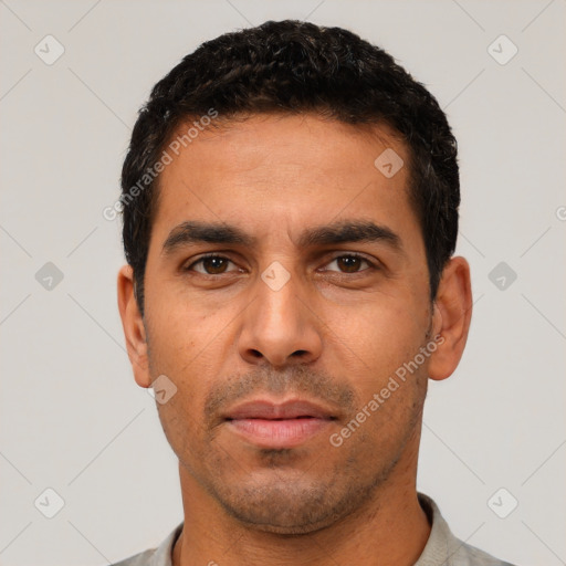 Neutral latino young-adult male with short  black hair and brown eyes