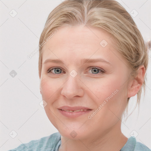 Joyful white young-adult female with medium  brown hair and blue eyes