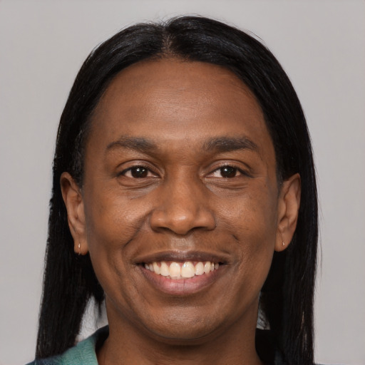 Joyful black young-adult male with medium  black hair and brown eyes