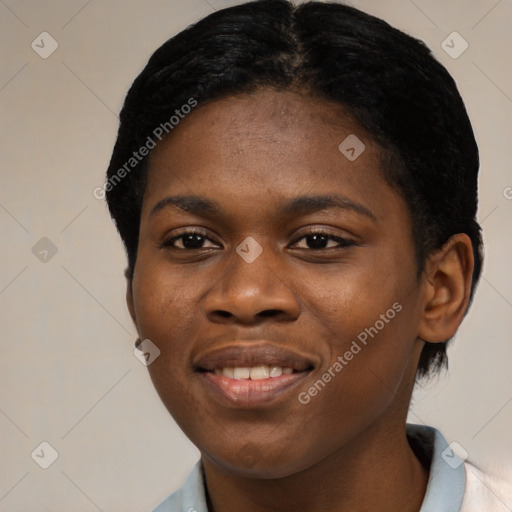 Joyful black young-adult female with short  black hair and brown eyes