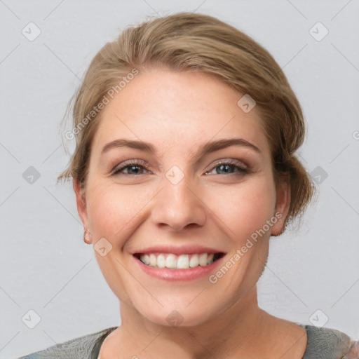 Joyful white young-adult female with medium  brown hair and blue eyes