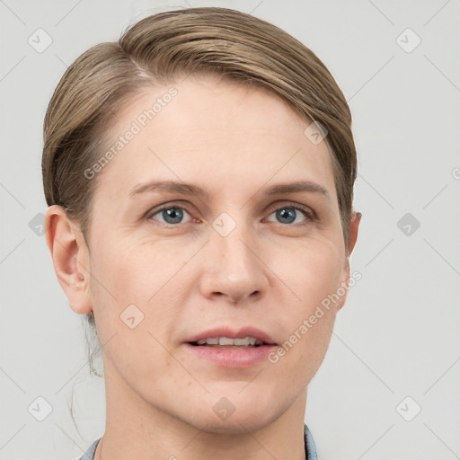 Joyful white young-adult female with short  brown hair and grey eyes