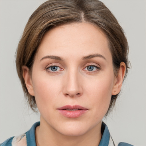 Neutral white young-adult female with medium  brown hair and blue eyes