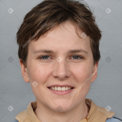 Joyful white young-adult female with short  brown hair and grey eyes