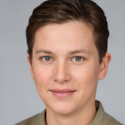 Joyful white young-adult female with short  brown hair and grey eyes