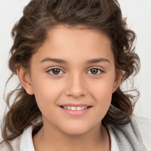 Joyful white child female with medium  brown hair and brown eyes