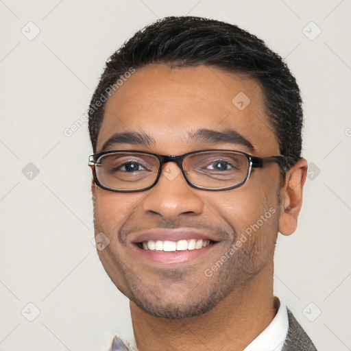 Joyful white young-adult male with short  black hair and brown eyes