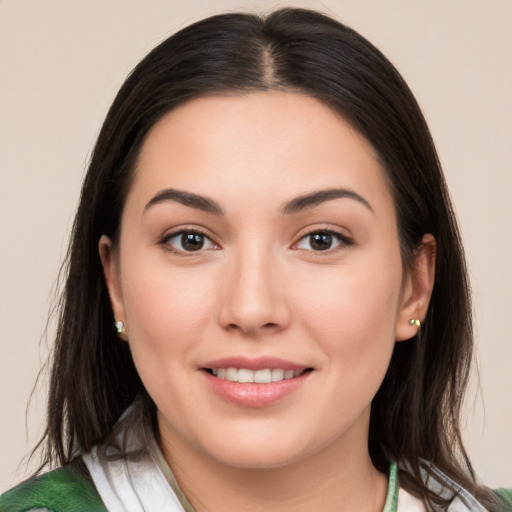 Joyful white young-adult female with medium  brown hair and brown eyes