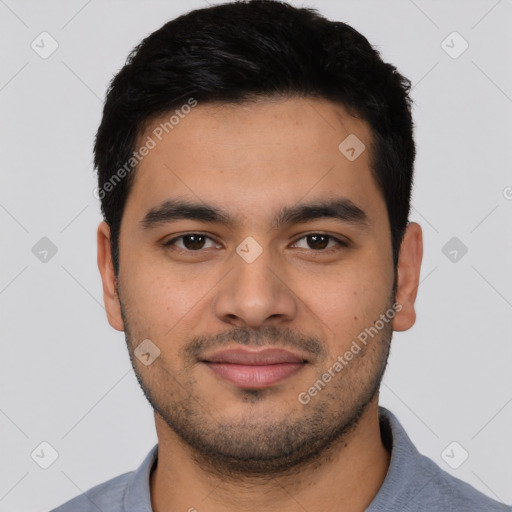 Joyful latino young-adult male with short  black hair and brown eyes