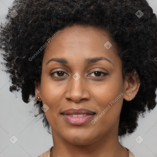 Joyful black adult female with short  brown hair and brown eyes