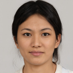 Neutral asian young-adult female with medium  brown hair and brown eyes