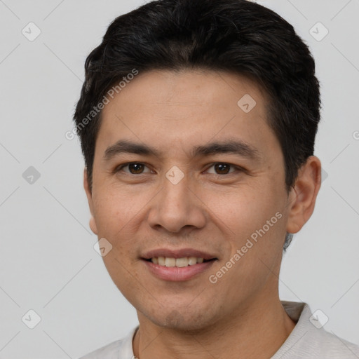 Joyful white young-adult male with short  black hair and brown eyes