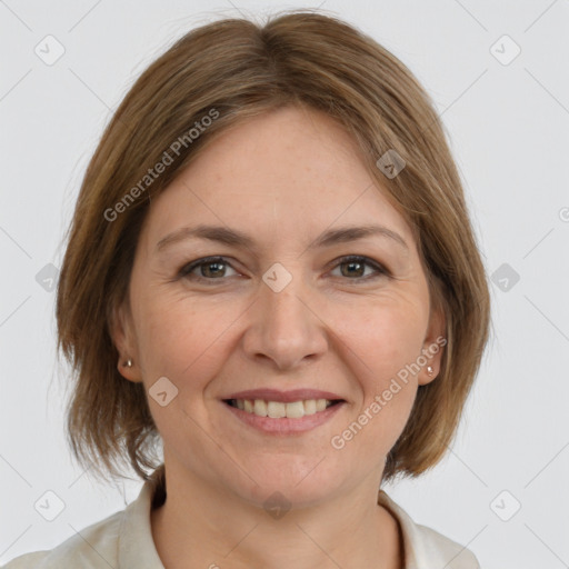 Joyful white adult female with medium  brown hair and grey eyes