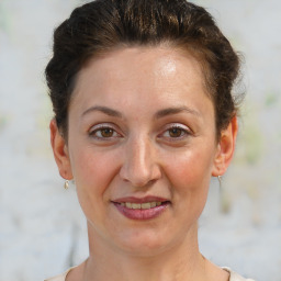 Joyful white adult female with short  brown hair and brown eyes