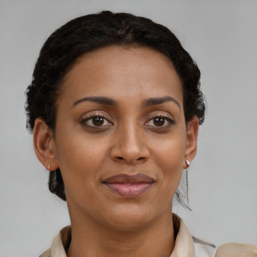 Joyful latino young-adult female with short  brown hair and brown eyes
