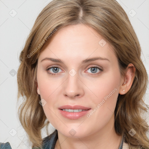 Joyful white young-adult female with medium  brown hair and blue eyes