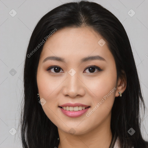 Joyful asian young-adult female with long  brown hair and brown eyes