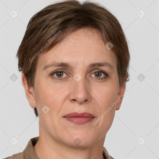 Joyful white adult female with short  brown hair and grey eyes