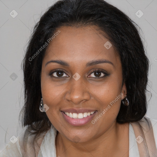 Joyful black young-adult female with medium  brown hair and brown eyes