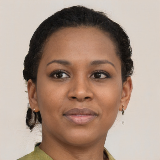 Joyful black young-adult female with short  brown hair and brown eyes