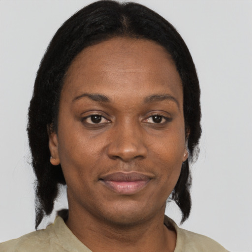 Joyful black young-adult female with medium  black hair and brown eyes
