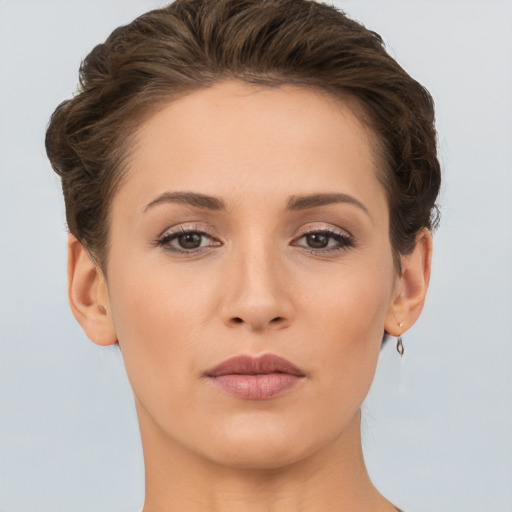 Neutral white young-adult female with short  brown hair and brown eyes